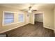 Bright living room with hardwood floors, large windows, and a ceiling fan at 648 Ozburn Nw Rd, Atlanta, GA 30318
