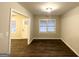 Cozy living room featuring hardwood floors and ample natural light at 648 Ozburn Nw Rd, Atlanta, GA 30318
