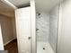 Modern tiled shower with glass door in a newly remodeled bathroom at 3174 Kingston Nw Rd, Atlanta, GA 30318