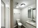 Bathroom with a vanity, granite countertop, modern fixtures, and vinyl flooring at 3174 Kingston Nw Rd, Atlanta, GA 30318