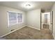 Cozy bedroom with neutral walls, and natural light from a window at 3174 Kingston Nw Rd, Atlanta, GA 30318