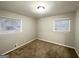 Bedroom featuring neutral colors and plenty of natural light from two windows at 3174 Kingston Nw Rd, Atlanta, GA 30318