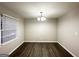 Well-lit dining room with hardwood floors and a modern chandelier at 3174 Kingston Nw Rd, Atlanta, GA 30318