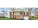 Charming brick home featuring a covered front porch and well-maintained landscaping at 3174 Kingston Nw Rd, Atlanta, GA 30318