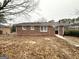 Brick home exterior with large yard and mature trees at 3174 Kingston Nw Rd, Atlanta, GA 30318