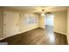 Living room featuring a ceiling fan, wood floors, and lots of natural light at 3174 Kingston Nw Rd, Atlanta, GA 30318