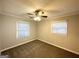 Comfortable bedroom with ceiling fan and natural light from two windows at 3609 Croft Nw Pl, Atlanta, GA 30331