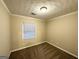 Cozy bedroom with neutral walls, plush carpet, and a bright window at 3609 Croft Nw Pl, Atlanta, GA 30331