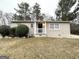 Classic brick home with a well-kept yard and covered front porch at 3609 Croft Nw Pl, Atlanta, GA 30331