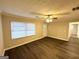 Bright living room with modern flooring, neutral walls, and ample natural light at 3609 Croft Nw Pl, Atlanta, GA 30331