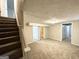 View of the finished basement featuring neutral walls, carpet floors and an open floor plan at 4250 Utoy Sw Ct, Atlanta, GA 30331