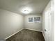 Cozy bedroom with neutral walls, carpet flooring, and a bright window for natural light at 4250 Utoy Sw Ct, Atlanta, GA 30331