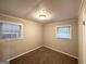 Neutral-toned bedroom with carpet, natural light from a large window, and a closet at 4250 Utoy Sw Ct, Atlanta, GA 30331