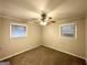Comfortable bedroom featuring a ceiling fan, carpeted floors, and bright, natural light at 4250 Utoy Sw Ct, Atlanta, GA 30331