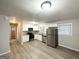 Modern kitchen with stainless steel appliances, granite countertops, and white cabinets at 4250 Utoy Sw Ct, Atlanta, GA 30331