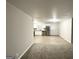 Bright open-concept living space flowing into a modern kitchen with stainless steel appliances at 4250 Utoy Sw Ct, Atlanta, GA 30331