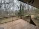 The back deck overlooks a private, wooded back yard at 6982 Knollwood Dr, Morrow, GA 30260