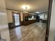This kitchen features wood cabinets, stainless appliances, and laminate floors at 6982 Knollwood Dr, Morrow, GA 30260