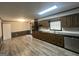 This kitchen features wood cabinets, stainless appliances, and laminate floors at 6982 Knollwood Dr, Morrow, GA 30260