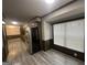 This kitchen features stainless refrigerator, wood cabinets, and laminate floors at 6982 Knollwood Dr, Morrow, GA 30260