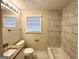 Bathroom with modern fixtures, tile accents, and a granite vanity at 1756 Lynn Ln, Decatur, GA 30032