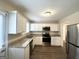 Well-lit kitchen featuring modern appliances and granite countertops at 1756 Lynn Ln, Decatur, GA 30032