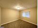 Cozy bedroom with neutral walls, carpet floors, and a bright window for natural light at 1761 Carter Cir, East Point, GA 30344