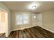 Bright living area features wood-look floors, neutral walls, large windows, and ample lighting at 2193 Polar Rock Sw Ave, Atlanta, GA 30315