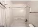 Clean bathroom featuring a tub with white surround, and chrome fixtures at 2537 Bonnybrook Sw Dr, Atlanta, GA 30311