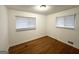 Comfortable bedroom featuring hardwood floors and two windows for natural light at 2537 Bonnybrook Sw Dr, Atlanta, GA 30311