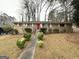 Traditional brick home featuring manicured shrubbery and a walkway to the front door at 2537 Bonnybrook Sw Dr, Atlanta, GA 30311