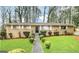 Charming brick home featuring a well-maintained front yard with lush green grass and manicured shrubbery at 2537 Bonnybrook Sw Dr, Atlanta, GA 30311