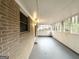 Enclosed porch features gray painted floor and lots of light through multiple windows at 2537 Bonnybrook Sw Dr, Atlanta, GA 30311