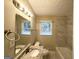 Bright bathroom with granite vanity, new tile in the shower and floors, and a modern, clean feel at 2544 Brentwood Rd, Decatur, GA 30032