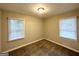 Comfortable bedroom with soft carpet, neutral walls, and natural light streaming in from the windows at 2544 Brentwood Rd, Decatur, GA 30032