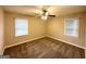 Cozy bedroom with carpet, a ceiling fan, natural light from the windows, and neutral walls at 2544 Brentwood Rd, Decatur, GA 30032