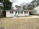 Single-story home featuring a welcoming entrance, dark shutters, and a convenient carport at 2544 Brentwood Rd, Decatur, GA 30032