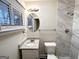 Updated bathroom features a marble tiled shower, granite vanity top, and modern fixtures at 2740 Bonnybrooke, Atlanta, GA 30311