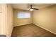 Cozy bedroom featuring a ceiling fan, plush carpet, and natural light from a large window at 2740 Bonnybrooke, Atlanta, GA 30311