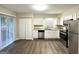 Modern kitchen with stainless steel appliances, granite countertops, and white cabinetry at 2740 Bonnybrooke, Atlanta, GA 30311