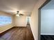 Bright living room featuring modern flooring, a ceiling fan, and a large window with natural light at 2740 Bonnybrooke, Atlanta, GA 30311