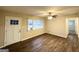 Bright living room featuring modern flooring, a ceiling fan, and a large window with natural light at 2740 Bonnybrooke, Atlanta, GA 30311