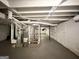 Unfinished basement with exposed pipes, stairs, and a water heater ready for customization at 3976 Bright Star Rd, Douglasville, GA 30135