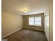 Bedroom featuring neutral walls, carpet flooring, and a bright window at 3976 Bright Star Rd, Douglasville, GA 30135
