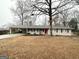 Exterior shot of a charming ranch home with a carport and brick facade at 3976 Bright Star Rd, Douglasville, GA 30135