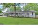 Charming one-story home with a well-maintained lawn and mature tree at 3976 Bright Star Rd, Douglasville, GA 30135