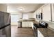 Well-lit kitchen featuring stainless steel appliances, granite countertops, and ample storage at 3976 Bright Star Rd, Douglasville, GA 30135