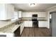 Kitchen featuring granite countertops, stainless steel appliances and white cabinetry at 3976 Bright Star Rd, Douglasville, GA 30135