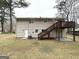 View of the backyard with upper and lower decks and access to the house at 4305 Old Lake Dr, Decatur, GA 30034