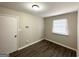 This bedroom has wood floors, a window with blinds, and a door to a closet at 4305 Old Lake Dr, Decatur, GA 30034